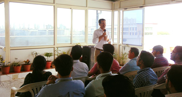 team celebrating 21 years of excellence and growth with joy and unity