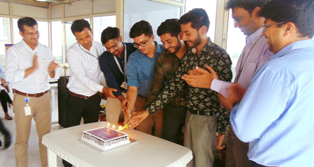 team celebrating 21 years of excellence and growth with joy and unity