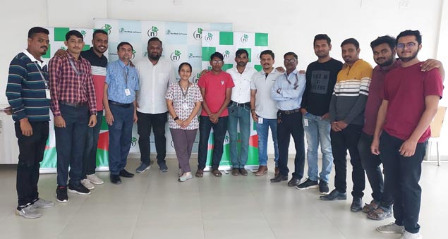 team members playing competitive indoor carrom tournament in 2022