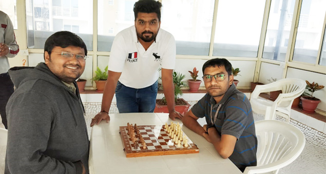 employees participating in a chess tournament promoting strategy and focus