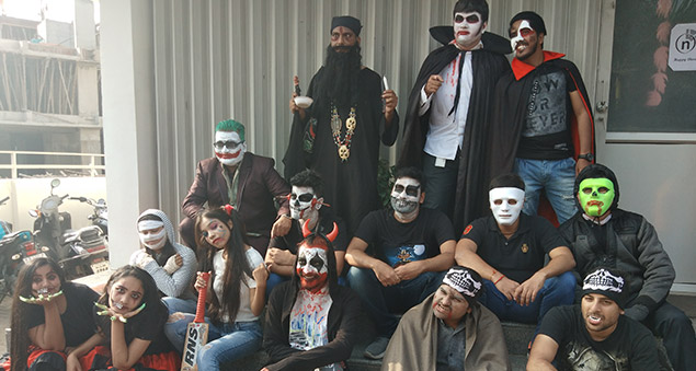 team members in creative costumes during halloween celebrations 2019