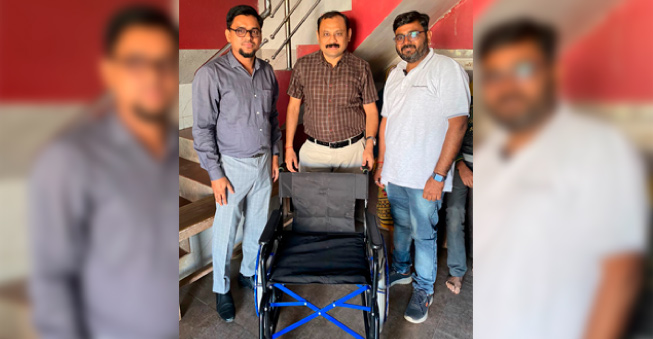 employees interacting and supporting specially-abled individuals during a community initiative
