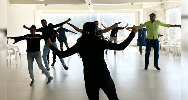 employees participating in wellness week activities promoting health and mental wellbeing